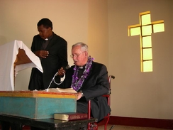Hoyt Osborne preaching with Pastor Sammy translating,