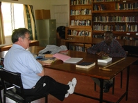 Pastor Chris Mwilu with David Gravino in Bible College Library