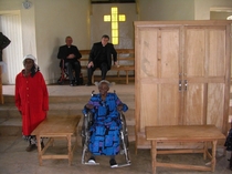Lady in wheelchair tithed a tree to the church, which was then used to make the cabinet and two tables.She was almost 100 years old at the time.