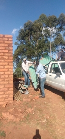 Moving material from temporary Tala church to build temporary Kanzalu Church