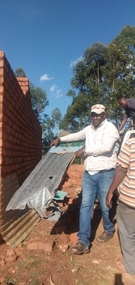 Moving material from temporary Tala church to build temporary Kanzalu Church