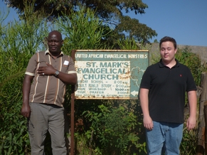 St. Mark's church sign with Gideon Kilonzo and Mac Freitas
